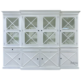 Front view of the Somerset 4 Door Display Wall Unit, highlighting its Hamptons-inspired design, signature cross detailing on the doors, and spacious shelving, perfect for use as a display unit or bookshelf.