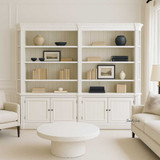 Front view of the Stonefield Double Bookcase Wall Unit with Angled Sides in situ in a living room setting