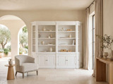 Luxury Hamptons display bookcase with open shelving and integrated storage, featuring the Stonefield Double Display Cabinet Bookcase in a warm neutral interior.