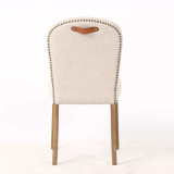 Rear view of the Stratford Dining Chair displaying its tailored textured weave back, brass stud trim and signature top grain leather pull handle, ideal for modern Hamptons dining interiors.