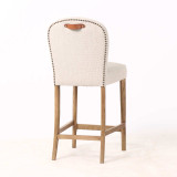 Three quarter rear view of the Stratford Kitchen Stool in performance woven textile with natural legs with top grain leather handle, reflecting contemporary timeless craftsmanship by Thomas & Hurley.