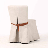 Three quarter rear view of the Carlyle Dining Chair in architectural weave and bespoke leather tie, reflecting premium craftsmanship and timeless modern Hamptons styling.