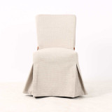Front view of the Carlyle Dining Chair in premium textured fabric slipcover by Thomas & Hurley, showcasing refined contemporary design and modern Hamptons elegance.