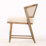 Minimalist side view of the Thomas and Hurley Windsor Dining Chair emphasising its sculptural timber frame, refined proportions and premium weave textured upholstered seat for welcoming and sophisticated dining.