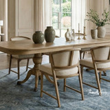 Styled image of the Windsor Dining Chair with the Berkshire Double Extension Dining Table displaying its sculpted timber frame, balanced proportions and textured neutral upholstery, ideal for luxury contemporary dining interiors.