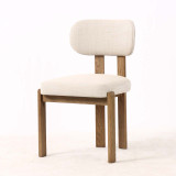 Front angled view of the Stuttgart Dining Chair in premium woven upholstery, displaying its elegant proportions and natural timber legs, ideal for modern and contemporary Hamptons dining spaces.