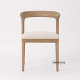 The elegant Laguna Dining Chair by Thomas and Hurley with handcrafted timber frame and contemporary minimalist aesthetic.