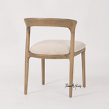 A luxury timber dining chair with upholstered seat by Thomas and Hurley, crafted for refined modern dining spaces.