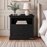 Fremont Black Bedside Table featuring two X-pattern drawers and an open display shelf.