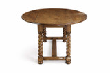 Side profile of the Churchill Barley Twist Oval Drop Leaf Extending Table by Thomas & Hurley with both leaves extended, emphasising the curved drop leaves, solid oak construction and refined heritage detailing for elegant interior schemes.