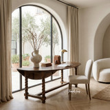 Handcrafted timber dining table and upholstered dining chairs by Thomas and Hurley combining traditional design influences with modern luxury styling.