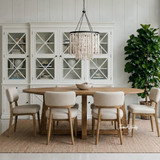 Ovalis 240cm natural oak dining table angled styled view in a luxury hamptons interior