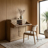 Angled styled view of the Reagan Desk showcased with the Argent Dining Chair in a modern home