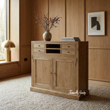 The Reagan oak campaign writing desk in closed position, showing storage and hand finished craftsmanship