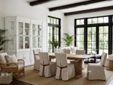 A styled living and dining room view of the Sandringham Double Extension Dining Table with Carlyle Chairs by Thomas and Hurley, perfect for Hamptons inspired and contemporary dining spaces.