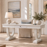 Luxury white writing desk styled with neutral accessories in a light contemporary living room