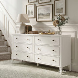 Lando 6 Drawer Chest in white styled beneath a gallery wall beside a staircase, featuring six spacious drawers, bronze knobs and classic Hamptons-inspired detailing.