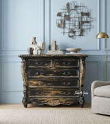 The Eloise 5 Drawer Chest in Black front styled view with French provincial detailing, intricate carving, and distressed antique finish.