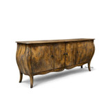 The Featherington Commode by Thomas and Hurley from an angled view showcasing its curved doors and warm layered patina.