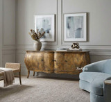 A front angled styled view of the Featherington Commode highlighting sculptural form,  hand-finished patina, and cabriole style legs.