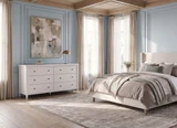 Thomas and Hurley white Brynmore chest of drawers featured in a calm luxury coastal style bedroom.
