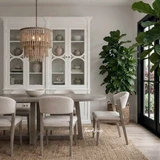 Stanton Dining Chair with brushed oak leg and neutral textured upholstery in a styled setting