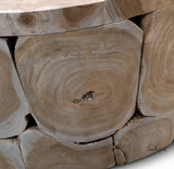 Close up of natural wood grain and exposed rings on the Maki round teak coffee table