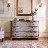 Curved serpentine three drawer bombe chest with aged blue-grey painted finish