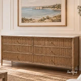 Brookstone six drawer chest with elegant marble surface and tapered legs in a warm Hamptons-style living room