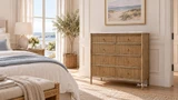 Hamptons style marble top drawer chest with elegant reeded detailing styled in a luxurious coastal bedroom with natural light and artwork