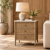 Luxury marble top bedside table featuring reeded drawer fronts and tapered legs in a contemporary styled room