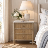 Thomas & Hurley Brookstone Bedside with Marble Top beside a linen upholstered bed in a Hamptons-style bedroom