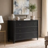 Traditional black chest of drawers with understated round metal knobs