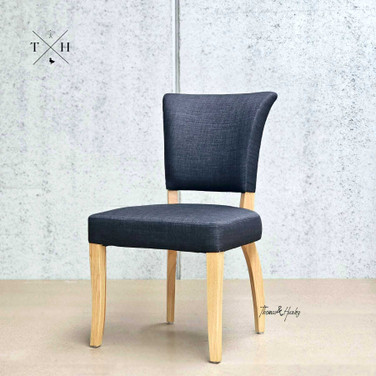 Angle view capturing the overall silhouette of the chair, highlighting the balance of comfort and style