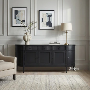 Front view of the Louis Curved Sideboard in black in 200cm in an elegant home