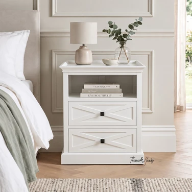 Fremont White Bedside Table featuring two X-pattern drawers and an open top shelf.