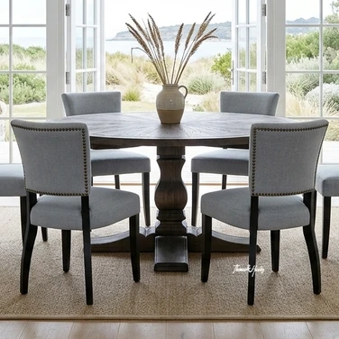 Darcy round oak parquetry table with Dalton upholstered dining chairs in a styled living room with natural light