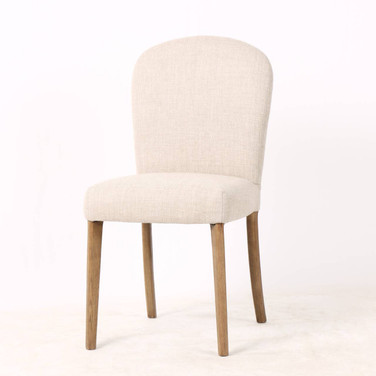 Three quarter front view of the Stratford Dining Chair featuring a premium performance weave, brass stud detailing and natural legs, perfect for modern Hamptons and contemporary dining spaces.