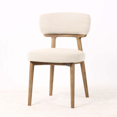 Three quarter front view of the Royston Dining Chair featuring premium textured upholstery and tapered timber legs for refined dining spaces.