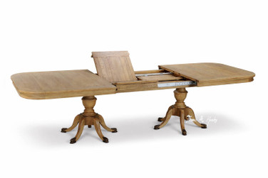 Luxury Berkshire Double Extension Dining Table by Thomas & Hurley in oak, fully extended with twin pedestal base and brass feet, showing leaf detail.