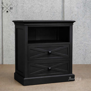 Front angled view of the Fremont Bedside Table in Black displaying the unique geometric drawer fronts and timeless design