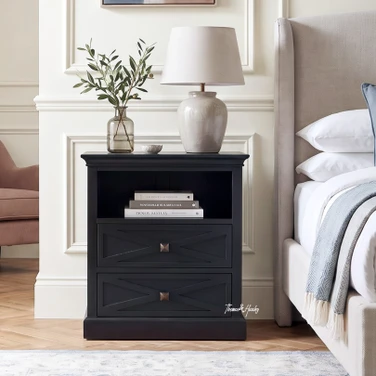 Elegant black storage nightstand featuring geometric drawer fronts and an open cubby.