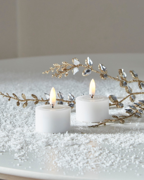 Raz 1.75" White Battery Operated Tealight Candles with Melted Tops and Realistic Flame 4559440 Raz 1.75" White Battery Operated Tealight Candles with Melted Tops and Realistic Flame 4559440