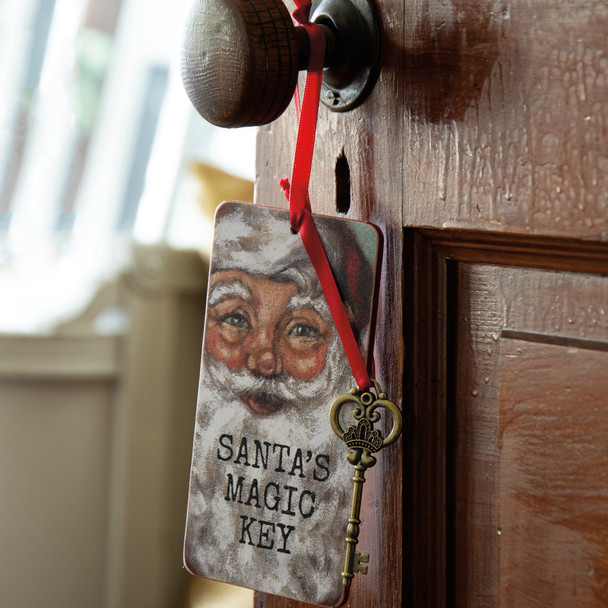 Vianočná ozdoba Primitive's od Kathy 6" Santa's Magic Key Christmas Ornament 113542