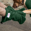 Close up of Labrador being dried by his owner wearing a pair of green Dogrobes UK dog drying mitts to dry his legs and paws.