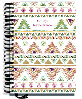 Pirongs Teacher Planner with a Quilt Pattern cover design.  The planner is bound with a silver wire and a black dots ribbon