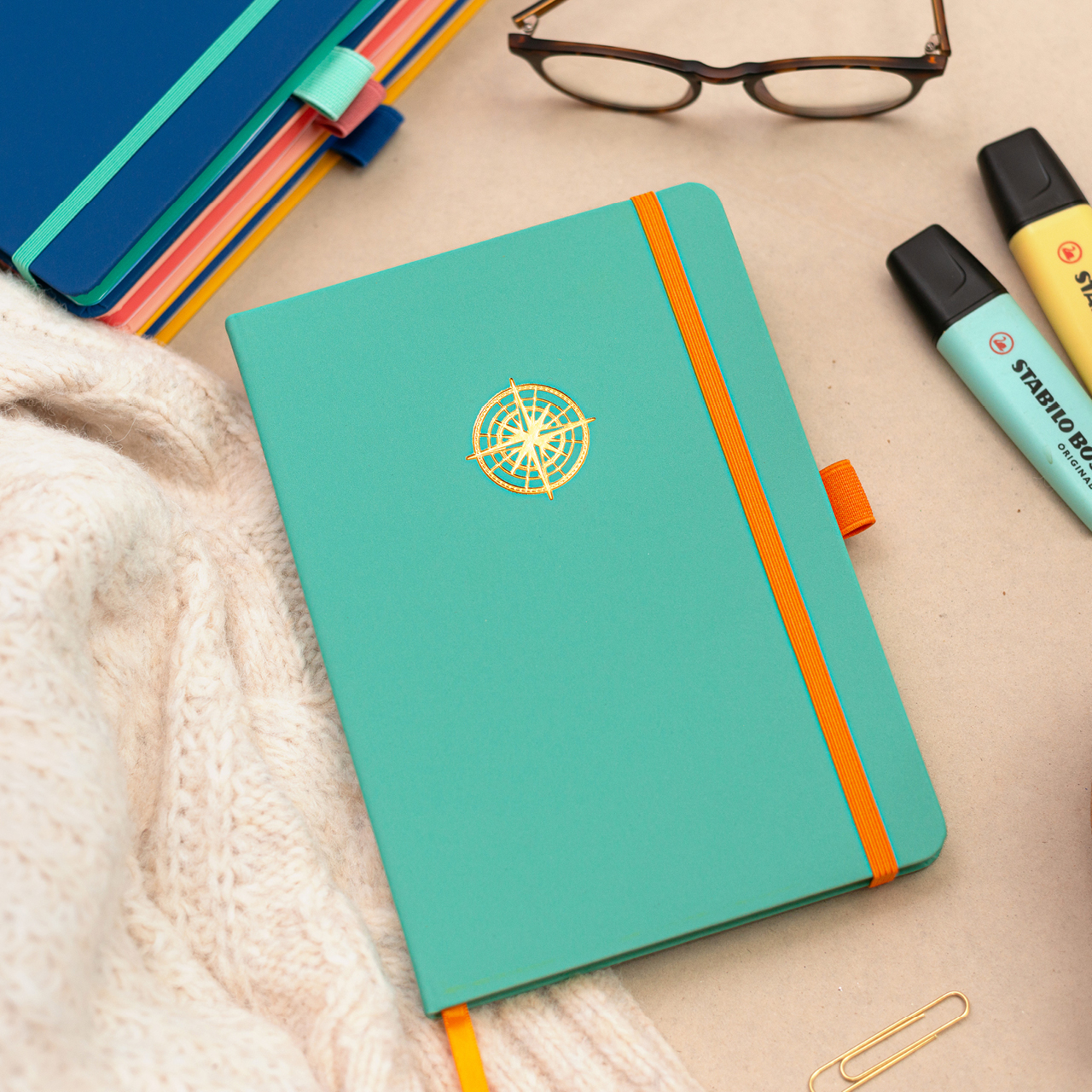 Pirongs Turquoise and Orange A5 Lined Notebook with Gold Foil Compass Icon