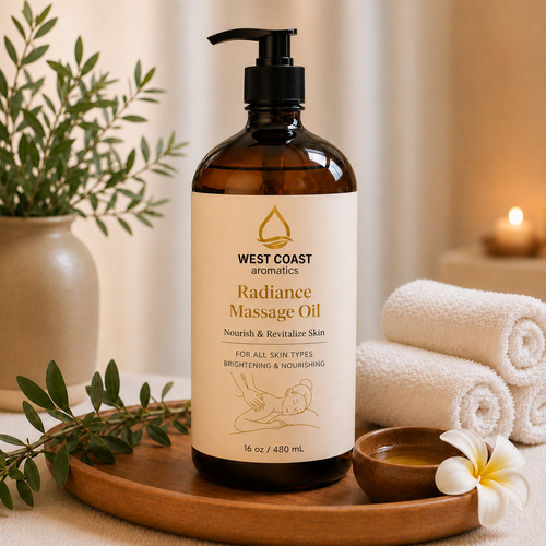 Radiance Massage Oil in amber pump bottle with elegant cream label by West Coast Aromatics, displayed on a spa tray with rolled towels, botanical leaves, candlelight, and tropical flower accents for a luxurious wellness and massage setting.