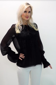 Sheer black blouse with accordion wrist sleeve