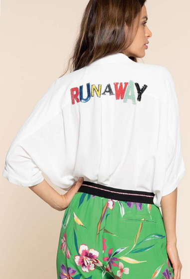 Gorgeous Casual Yacht Wear From Italy, white free flowing blouse with "Runaway" on the back of the blouse in elegant bright colors. 